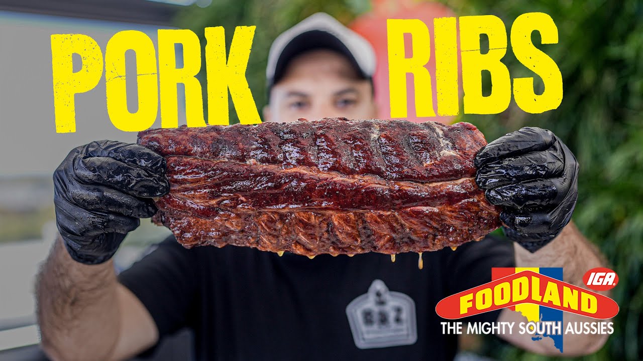 Smoked pork ribs held up for BBQ ribs recipe video