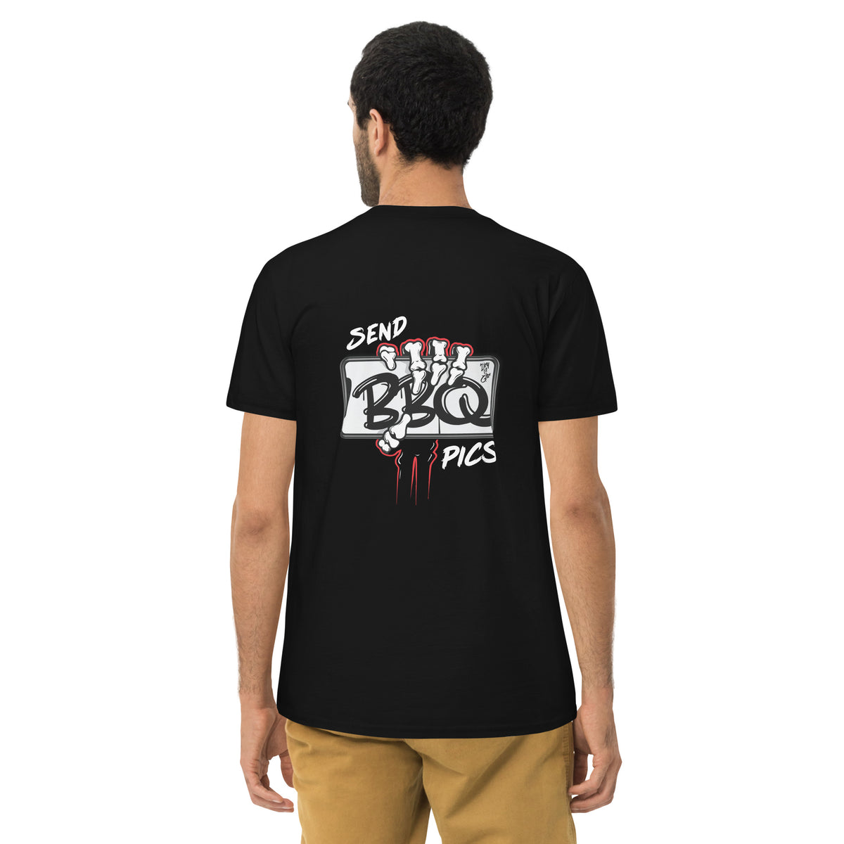Man wearing the tee seen from behind, the claw mark print across his back