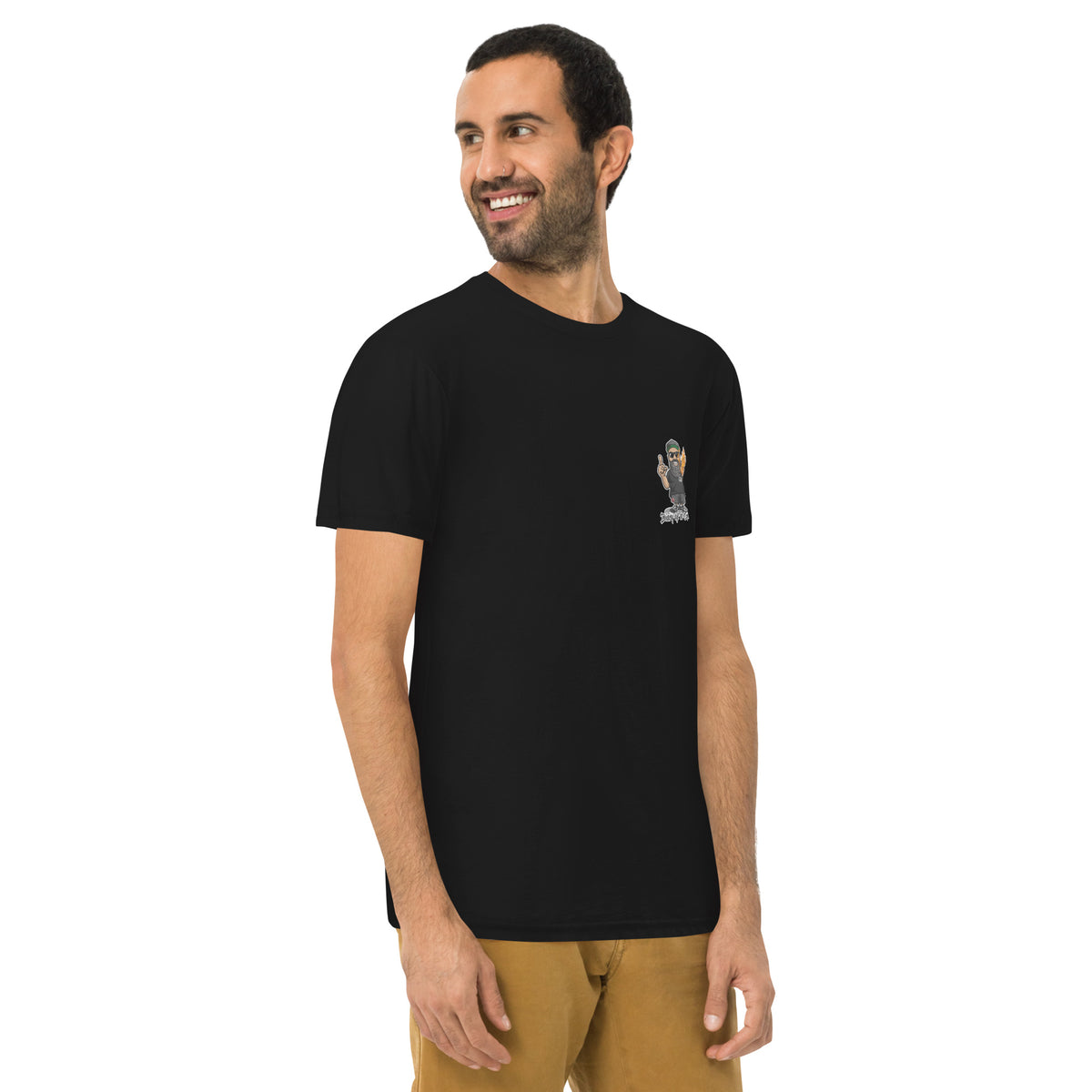 Man wearing the black tee from the front, the small chest badge just visible