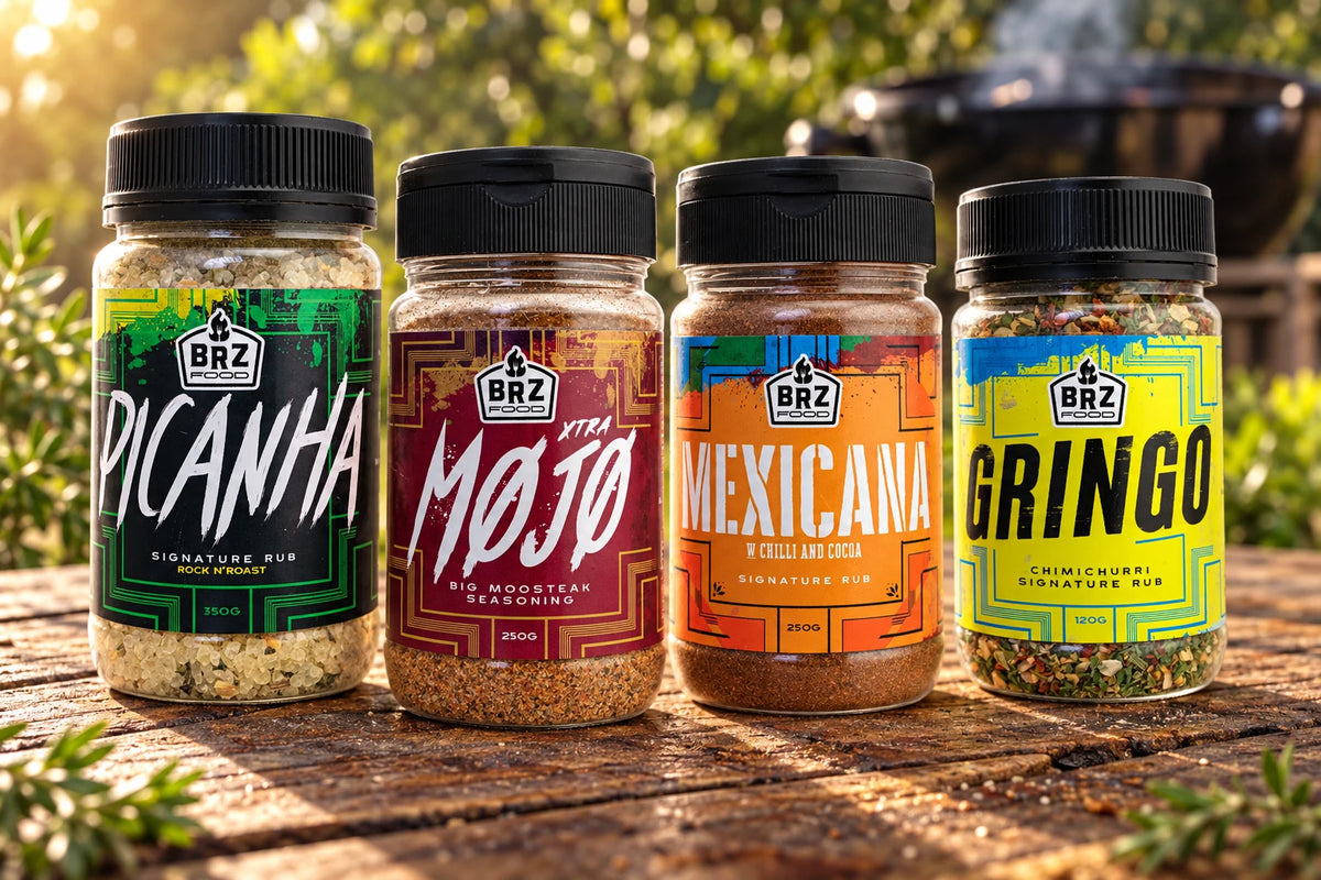 Picanha, Xtra Mojo, Mexicana and Gringo jars arranged on an outdoor barbecue table