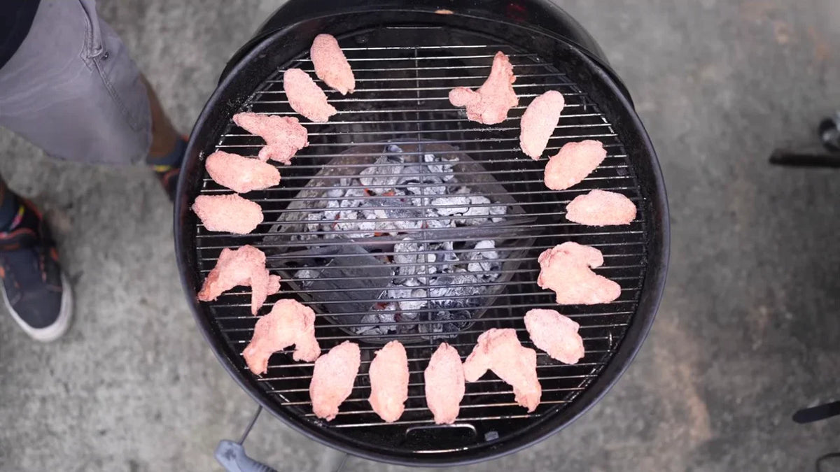 On the barbecue. Thunderbird chicken wings cooking on Adriano's barbecue